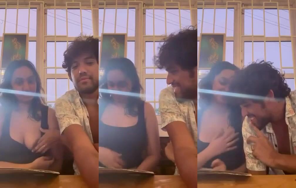 Naughty boyfriend teasing her gf's big boobs in restaurant